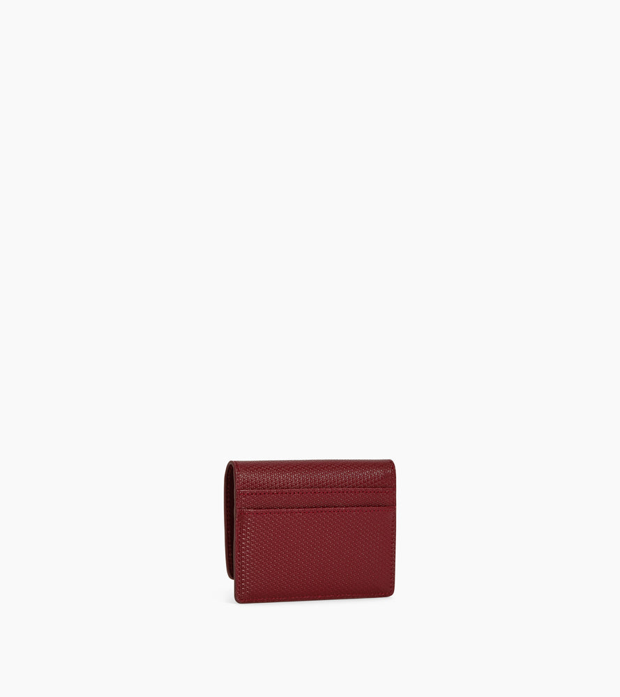 Tarjetero con solapa de piel con la T de la firma Emilie